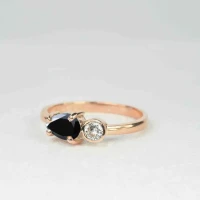 /public/photos/live/Pear Cut East West Black Moissanite Two Stone Ring 818 (2).webp